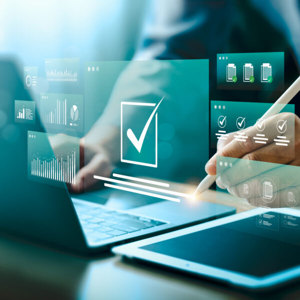 Digital approval and task management with futuristic interface. Businessman using stylus on tablet to complete checklist, analyze data on smart dashboard. Concept of workflow automation, e-signature.